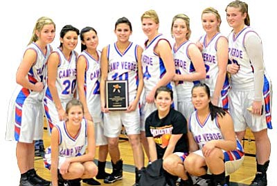 The Camp Verde girls basketball team poses for a picture with the 2010 Yvonne Johnson Memorial Shootout Championship plaque. VVN/Sean Morris