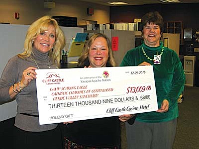 From left, Linda Johansen-James, Camp Soaring Eagle Board Vice Chair, Jane Hausner, Verde Valley Sanctuary Executive Director and Carol Quasula, Catholic Charities Site Director are please to accept their share of the special gift from Cliff Castle Casino-Hotel.