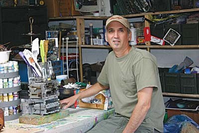 His toaster series has been divided into two separate series, a toaster shell series and a toaster insides series. Here Michael Craig Carrier works on a new creation using the insides of discarded toasters.
