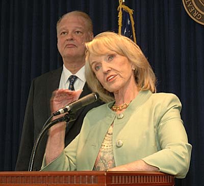Gov. Jan Brewer explains why she has directed Attorney General Tom Horne to ask a federal court to decide if Arizona can enforce its new medical marijuana law despite federal statutes making possession, sale and transportation of the drug illegal.  (Capitol Media Services photo by Howard Fischer)