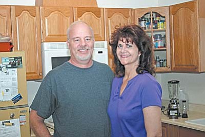 Jan Smith and her husband, Phil, stand in the kitchen of the Cottonwood home where she developed all of the recipes in her book, Jan’s Recipe Book. VVN/Philip Wright