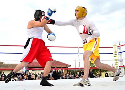 <b>Shawn Rojas</b> punches Patrick Ramirez in a boxing match Saturday afternoon on Main St. in Cottonwood. VVN/Sean Morris