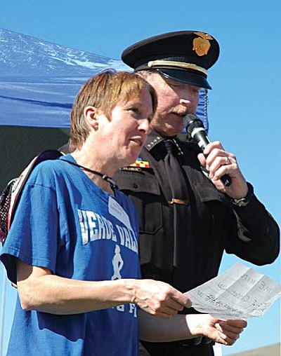 <b>Karen Videll</b> from Verde Valley Track & Field reads the Special Olympics creed with Prescott Valley Police Chief Bill Fessler. During opening ceremonies of the 18th annual Northern Arizona Special Olympics games Saturday, April 21, in Prescott Valley. “Let me win, but if I cannot win, let me be brave in the attempt.”<br /><br /><!-- 1upcrlf2 -->TribPhoto/Cheryl Hartz