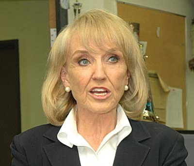 Gov. Jan Brewer: "I signed the bill after reading it and amending it as it went through the Legislature to make sure that it absolutely did what we wanted it to do, which is to address the terrible situation that Arizona was facing ... knowing that it would be a lightning rod in some arenas, that the race card would be thrown out.'