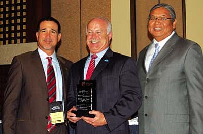 Cottonwood City Manager Doug Bartosh receiving the 2012 Gabe Zimmerman Award.