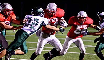 <b>Tyler Herndon</b> looks for the edge on a stretch play Friday night against Flagstaff on Bright Field. Herndon scored his first touchdown rushing of the season and added a receiving touchdown. VVN/Sean Morris
