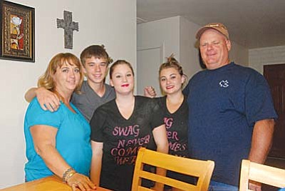Jerry and Tammie Oothoudt became foster parents four years ago. Along the line they adopted Kevin (second from left) and Vanaa (center) and taught their own daughter Krista that love has no limit. VVN/Steve Ayers
