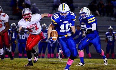 Marauder <b>Zach Pelletier</b> gives chase to Badgers’ senior standout <b>Brady Mengarelli</b> Friday night on Bill Shepard Field. Mengarelli rushed for 209 yards, but just one touchdown. VVN/Sean Morris
