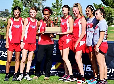 <b>The Mingus girls cross country team</b> poses for a picture after placing second at the state meet Saturday at Cave Creek Golf Course. LEFT TO RIGHT: Anissa Urueta,  Sienna Gehl, Justine Taylor, Skyler Storie, Brenna McCallum, Monica Soliz, Nicole Zienka.