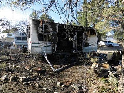 Fire claimed an RV and threatened a mobile home in Cottonwood on Wednesday.