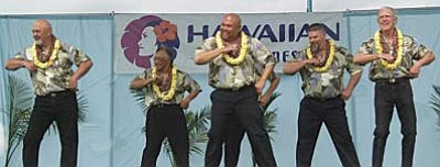 If you think Men’s Hula is just wiggling around in a grass skirt, you’re in for a pleasant surprise. Some Hawaiian scholars believe that in the early days, hula was only danced by men. Many believe that the hula steps of today come from early Hawaiian martial arts.