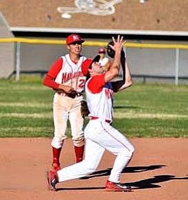 Sophomore Pete Kelly ices the fourth inning of the Marauders 11–0 win over Kingman by catching the pop fly. VVN/Travis Guy