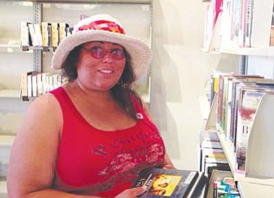 Jeanette Romero enjoys checking out DVDs from Sedona Public Library in the Village. 