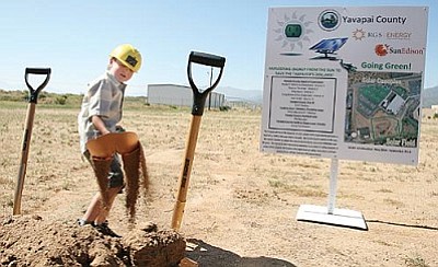 Five-year-old Alden Webb, grandson of Yavapai County Facilities Director Ken Van Keuren, takes a turn shoveling dirt following Friday's groundbreaking ceremony for a solar field and parking canopies at the Camp Verde Detention Center. VVN/Bill Helm