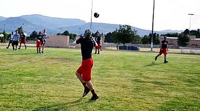 Senior Herb Tiffany readies his hands for the incoming pass against Sedona during a 7-on-7 game at Camp Verde High School. Mingus’ receiving game has made strides since the beginning of the summer according to head coach Bob Young. VVN/Travis Guy