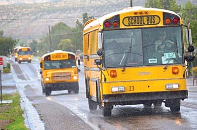 A line of buses leaves Cottonwood Middle School. VVN/Vyto Starinskas
