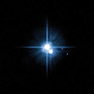 Pluto and its moons as photographed by NASA’s Hubble space telescope in 2005.