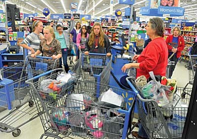 Marilyn Caneloupe and her Cottonwood Middle School students purchase clothing for the needy at Walmart on Wednesday. VVN/Vyto Starinskas