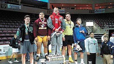 Wyatt Midkiff (center) won the Mile High Championship for the 220 pound weight class. Midkiff hasn’t lost a match this season. But, head coach Tim McKeever said it’s too early to talk about a perfect season. Photo courtesy of Tim McKeever