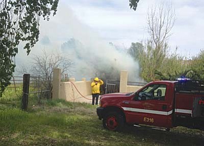 Assistant Verde Valley Fire Chief Jerry Doerksen said the blaze, in this case, may have started from remains of  a controlled burn that was not fully extinguished and re-ignited. He says it was also fanned by the weekend winds. Firefighters moved in to protect area houses and extinguished the fire. Courtesy photo, Verde <br /><br /><!-- 1upcrlf2 -->Valley Fire District.