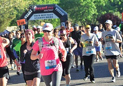 Runners compete in the Brian Mickelsen Memorial race Saturday morning starting from Riverfront Park, some heading downtown and other towards Dead Horse State Park. VVN/Vyto Starinskas