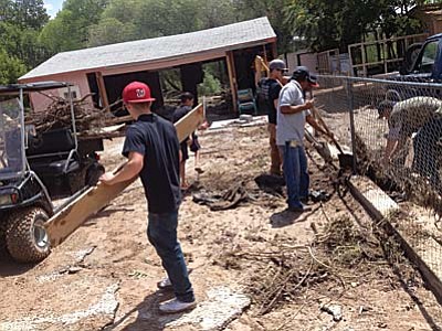 Verde Lakes residents clean up after floods that resulted from Friday night’s heavy rains. Camp Verde, Sedona, and Montezuma-Rimrock fire personnel worked together to rescue and/or evacuate 15 people and several pets. VVN photo by Vyto Starinskas