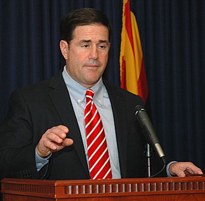 Gov. Doug Ducey details Wednesday how Arizona will cancel its contract with the operator of a private prison following a riot there. But the governor rejected questions of whether the Department of Corrections is at fault for failing to properly monitor the facility and anticipate the problems.  (Capitol Media Services photo by Howard Fischer)