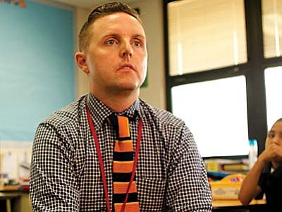 Sean Conway, a fourth-grade teacher at Clarendon Elementary School in Phoenix, discusses his school’s support for children taking the new AzMERIT test. (Cronkite News Photo by James Anderson)