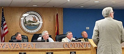 The Yavapai County Board of Supervisors join Cottonwood resident Frank Henry in watching Lynn Constabile, Yavapai County elections director via remote telecast during its Nov. 16 meeting. Constabile offered her view on the handling of ballots during the Nov.3 special election for school funding. (VVN/Tom Tracey)<br /><br /><!-- 1upcrlf2 -->