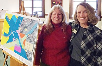 Unveiling a map of the proposed State Route 89A development in Clarkdale are Ida deBlanc, vice chair of the planning committee and Jodie Filardo, community and economic development director. (VVN/Tom Tracey)