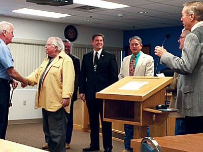 The Jerome Fire Department is presented with a fire prevention grant at the Dec. 21 Yavapai County Board of Supervisors meeting. From left: Jerome Fire Department Assistant Chief Bill Volk; Jerome Mayor Lew Currier; Yavapai County Supervisors Rowle Simmons, Jack Smith, Chip Davis, Craig Brown and Thomas Thurman. (VVN/Tom Tracey)