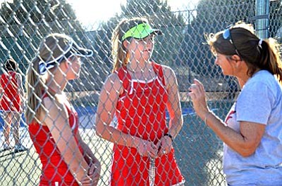 Head Coach Andrea Meyer (right) speaks to Phoebe Chilton and Emma Williams during their match against Flagstaff earlier this season. The Mingus Marauders are currently 4-0 heading into their match-up against Sunrise Mountain on March 10. (Photo by Vyto Starinskas)