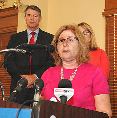 Dana Naimark, president of the Children’s Action Alliance, details Monday what steps lawmakers need to take now that Proposition 123 has been approved. With her is Dick Foreman, president of the Arizona Business and Education Coalition. (Capitol Media Services photo by Howard Fischer)