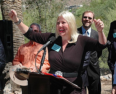Sen. Debbie Lesko celebrates a new law she sponsored which will allow property owners to rent out houses to vacationers regardless of city regulations. (Capitol Media Services photo by Howard Fischer)
