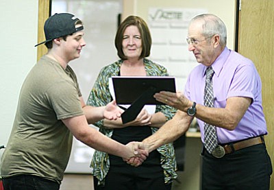 Valley Academy Career and Technology Education recently recognized Brian Porter, 2016 graduate of Mingus Union High School, for completing career and technology education programs in automotive technology, mechanical drafting and technical theatre. Also pictured, VACTE Program Manager Donna Green and board President Steve Dockray.