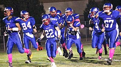 The Camp Verde Cowboys take the field at the end of their season last year, with the seniors leading the way. (File Photo by Greg Macafee/VVN)