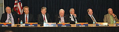 Corporation Commission candidates Andy Tobin, Boyd Dunn, Bill Mundell, Al Melvin, Tom Chabin, Rick Gray and Bob Burns debating utility issues on Wednesday. (Capitol Media Services photo by Howard Fischer)