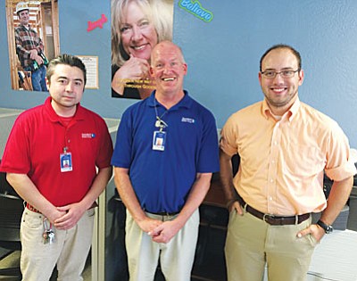 Goodwill Retail Team Leader Adam Sandoval, Team Member Warren Hille and Job Connection Team Leader Dave Meyers agree: “We see the results of our work every day.” (Photo by Tom Tracey)