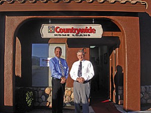 VVN/Megan Lee<br>
Loan officers for Countrywide Home Loans, Todd Crawford, left, and Rex Williams posed recently in front of the company’s new Cottonwood office. The office is located at 849 Cove Parkway, Suite C, in Cottonwood.
