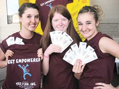 Submitted photo<br>
From left Crystal Heiser, Miranda Mann and Bayleigh Preston hold tickets to Sunday’s Yes I Can event. “Get Empowered” shirts will be for sale along South Fourth Street beginning Sunday at noon.