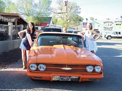 Photo/Alexandria Andrade<br>
Crystal Heiser, Miss Williams Route 66 2009 (left), and April Zicopoulos, Miss Williams Route 66 2010, pose with a classic car during the 24th Annual Fun Run held in Seligman April 29.
