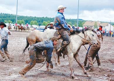 Photo/Jan Shirley<br>
Ranch cowboys compete in the bronc riding competition during last year’s Cowpunchers Rodeo. The event will be held beginning Friday at the Williams Rodeo Grounds.

