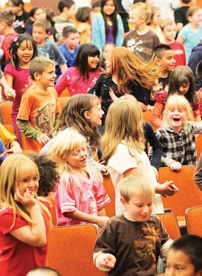 Ryan Williams/WGCN <br>
Williams Elementary Middle School students dance during a Flagstaff Symphony Orchestra outreach program featuring the Kruger Brothers held in the school auditorium in April.

