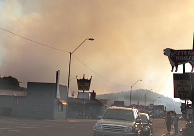 Ryan Williams/WGCN<br>
Smoke billows over Route 66 in Williams as the Twin Fire burns on Bill Williams Mountain in 2009. The Bill Williams Mountain Restoration project would treat 15,200 acres on the mountain to prevent catastophic fire events.