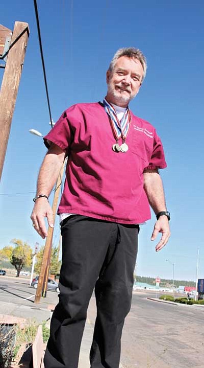Ryan Williams/WGCN<br>
George Bardwell displays gold medals he won during competition at the Flagstaff Senior Olympics held Oct. 8.