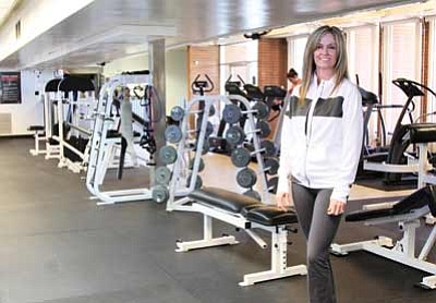 Ryan Williams<br>
Only open a few weeks, Results Fitness is already filling up fast. Janine Rotter stands in the main exercise room.