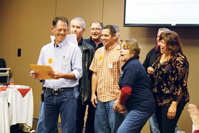 Submitted photo<br>
Clowning around singing to the tune of the Twelve Days of Christmas, board members highlight the many activities the chamber can be involved in to make Williams a better, more prosperous community. Jim Winbourn, who will be chairman of the board in 2012, leads the group.