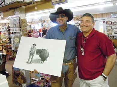 Gary Robert (left) proudly displays the charcoal drawing created by Ted Marple. Submitted photo