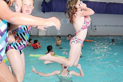 Kids enrolled in the Williams Recreation Center’s Summer Rec program enjoy the cool of the pool at the Williams Aquatic Center June 14. Ryan Williams/WGCN