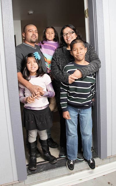 Rita and Jorge Vazquez and their children Mario, 10, Liliana, 7, and Daizy, 4 will begin moving into their new Habitat for Humanity home after a dedication ceremony Saturday. Ryan Williams/WGCN